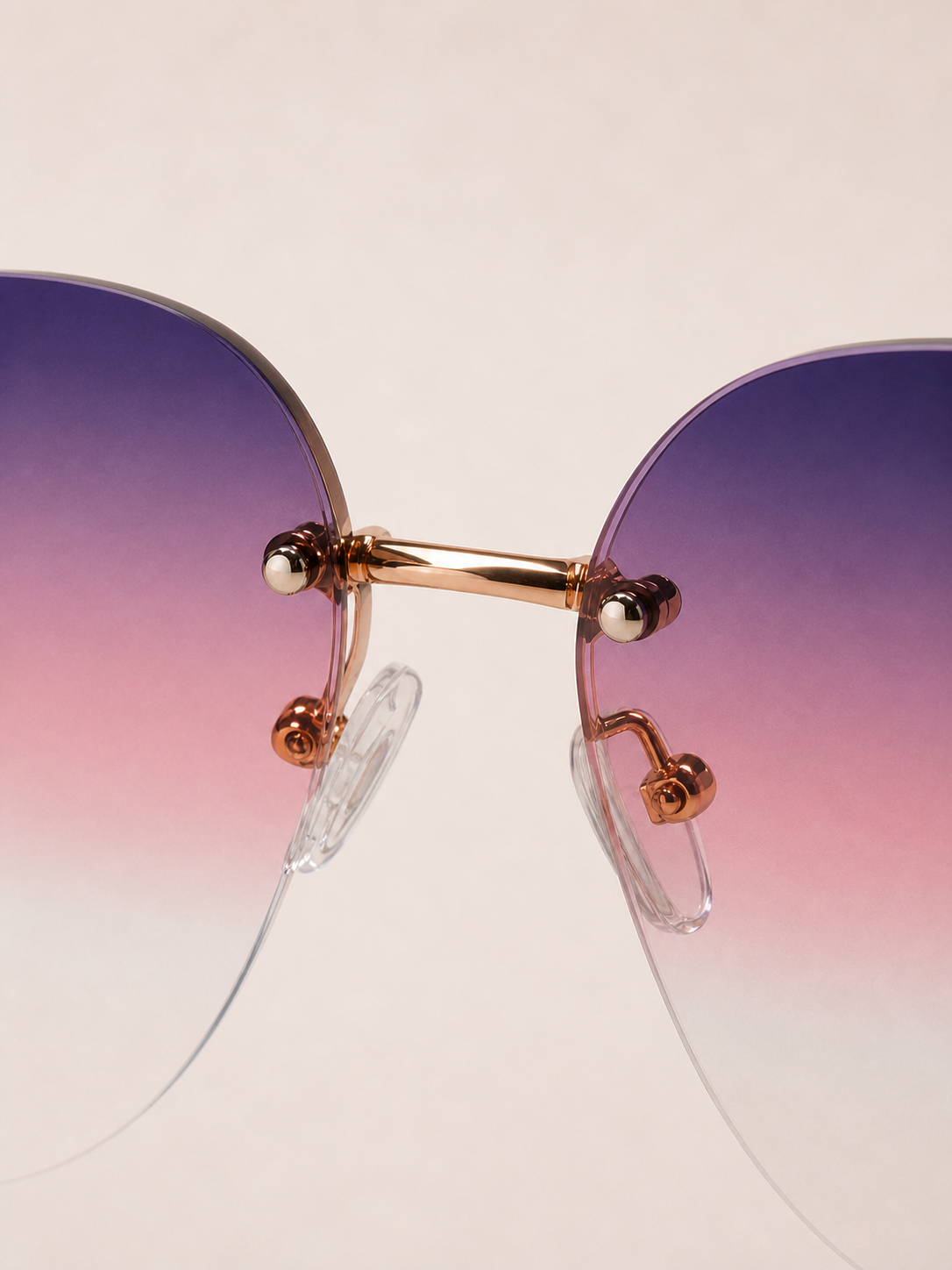 Close-up of Lumina rose-gold bridge and clear nose pads