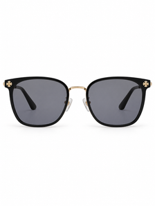 DESSON Dahlia black square sunglasses with gold-tone floral accents and grey lenses, front view.