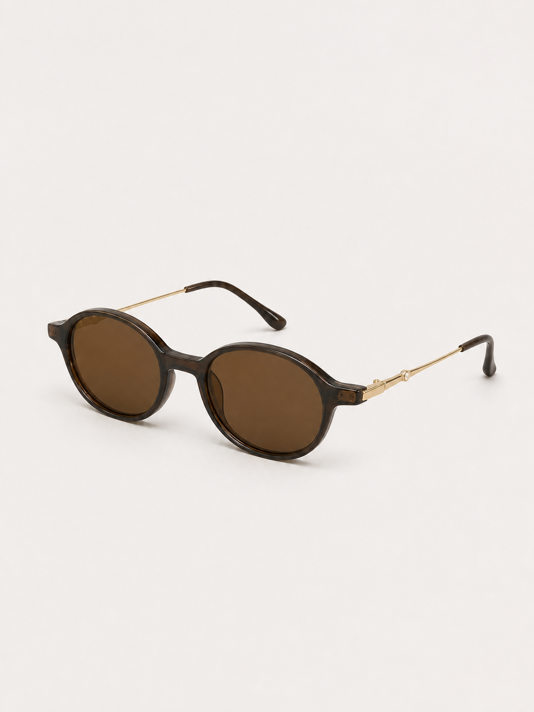 Sienna brown oval sunglasses shown from a three-quarter studio angle